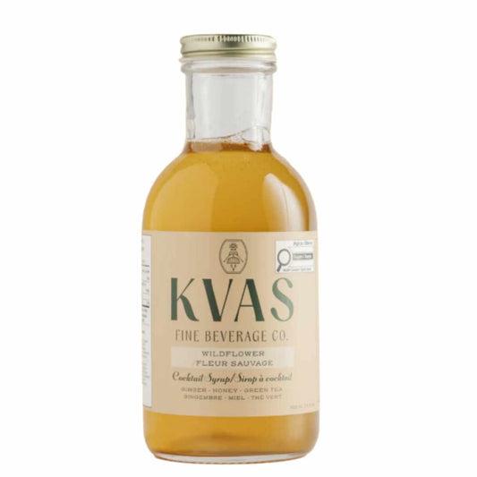 Bottle of KVAS Fine Beverage Co.  wildflower cocktail syrup on a white background